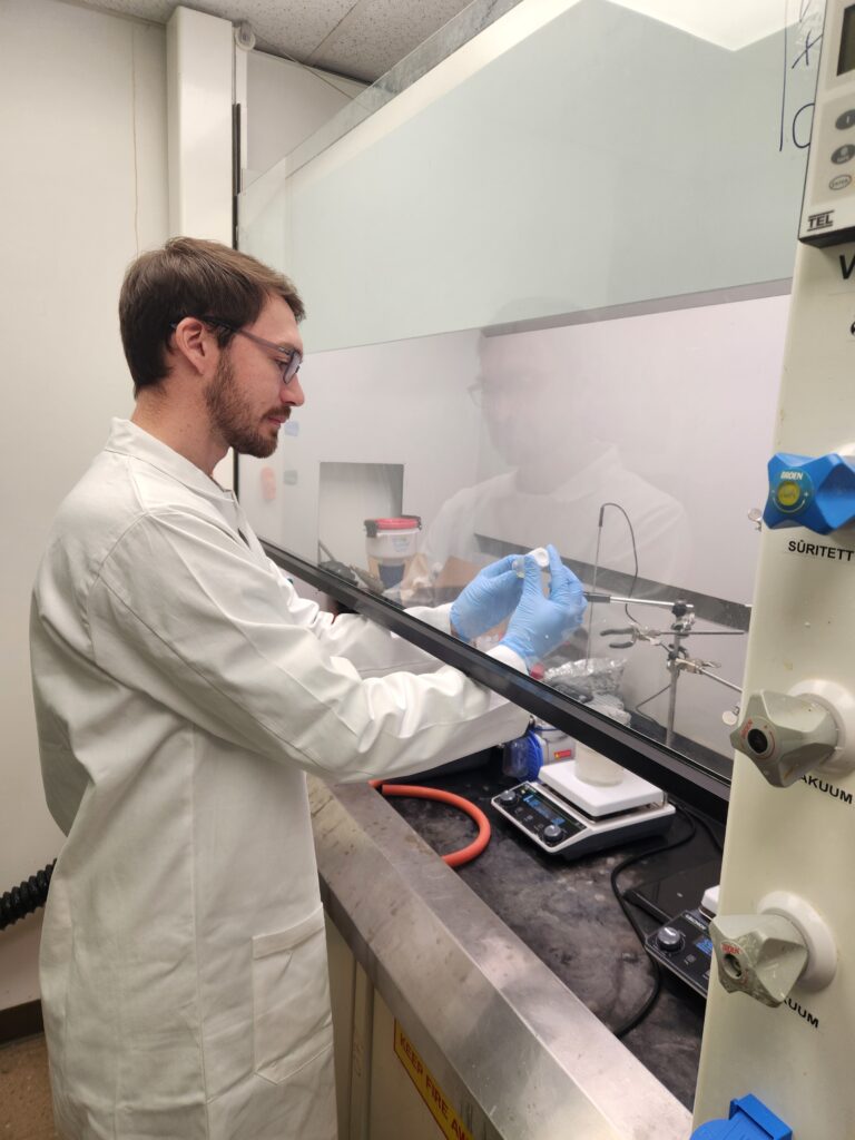 Orion Polymer CTO Greg Kline works in a chemistry hood